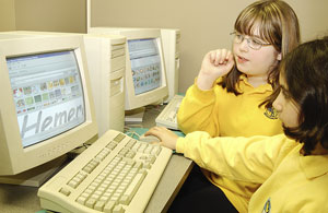 2 Young Girls at Computer