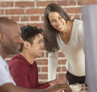 Smiling people with computers