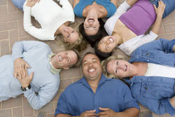 6 people laying on ground