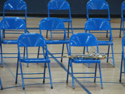 Saxophone with blue folding chairs
