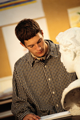 Student looking through reference books