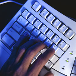 Hand at keyboard