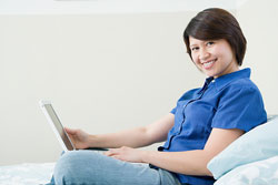 Woman on couch with laptop
