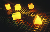 Yellow 3-D Solid Shapes on a grid