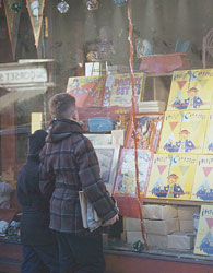 2 boys looking at store window