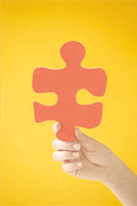 hand holding puzzle piece