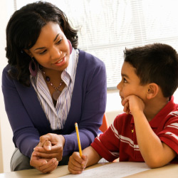 Teacher encouraging a student to do well with his summative assessment.